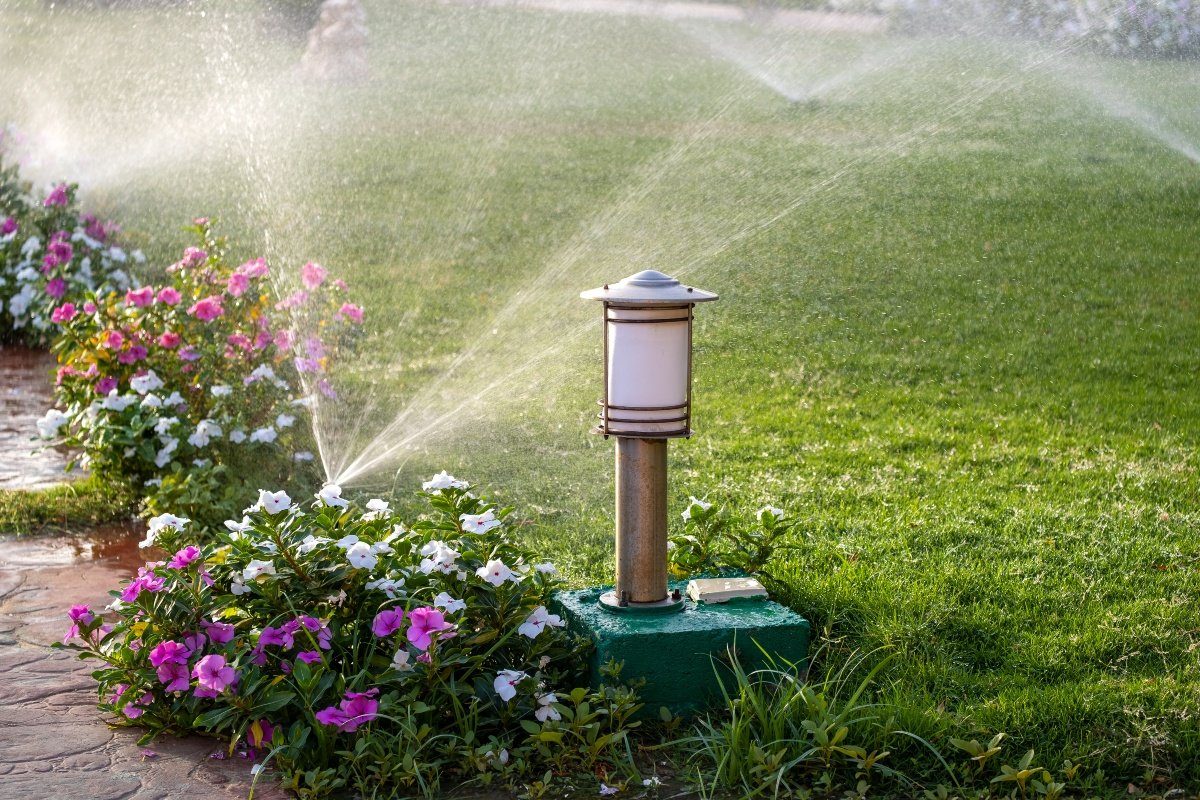 homeowner winterizing a sprinkler system